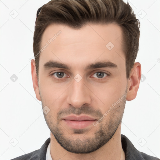 Neutral white young-adult male with short  brown hair and brown eyes