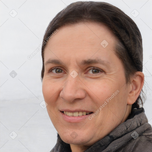 Joyful white adult female with short  brown hair and brown eyes