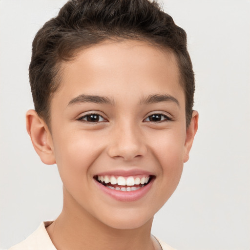 Joyful white child male with short  brown hair and brown eyes