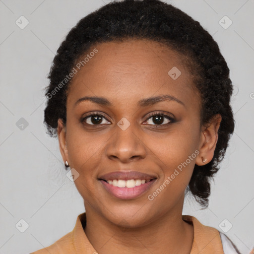 Joyful black young-adult female with short  black hair and brown eyes