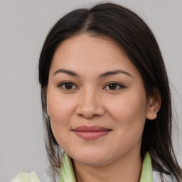 Joyful asian young-adult female with medium  brown hair and brown eyes