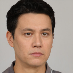 Neutral white adult male with short  brown hair and brown eyes