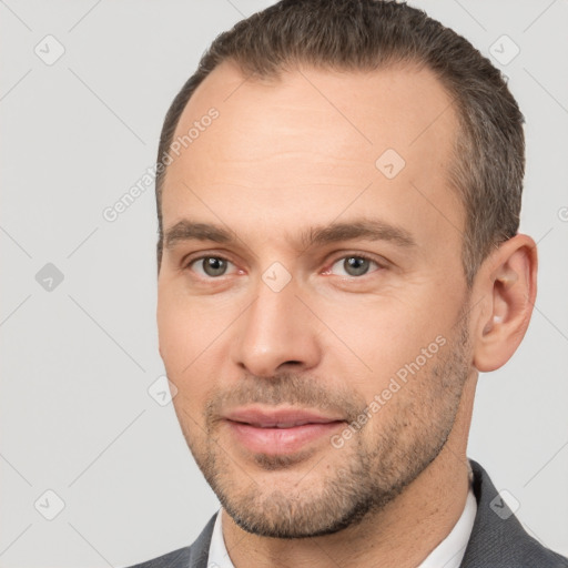 Joyful white adult male with short  brown hair and brown eyes