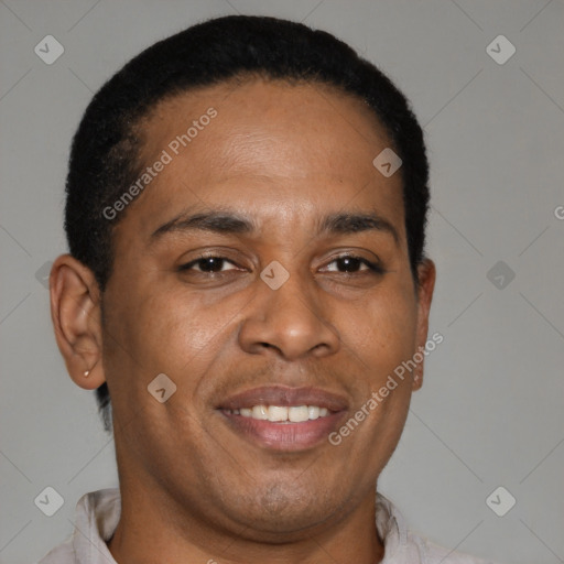 Joyful latino young-adult male with short  brown hair and brown eyes