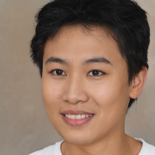 Joyful asian young-adult female with short  brown hair and brown eyes
