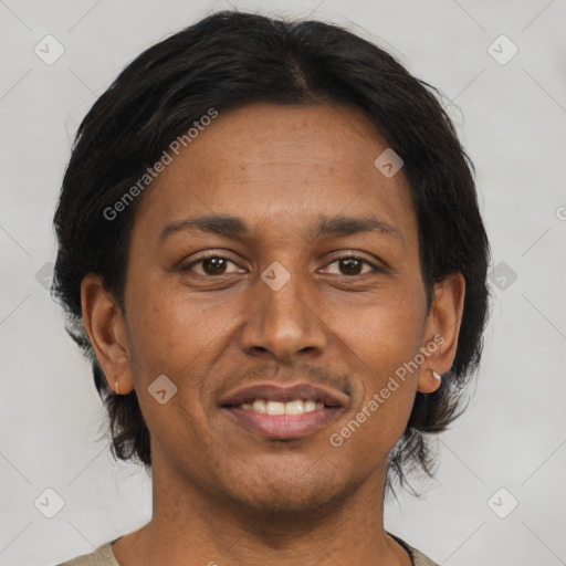 Joyful black adult female with short  brown hair and brown eyes