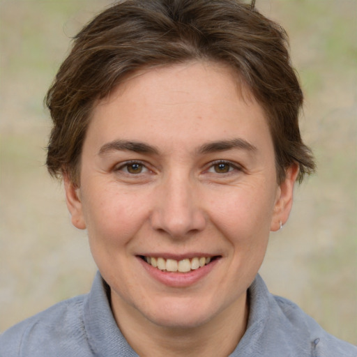 Joyful white adult female with short  brown hair and brown eyes