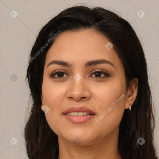 Joyful latino young-adult female with long  brown hair and brown eyes