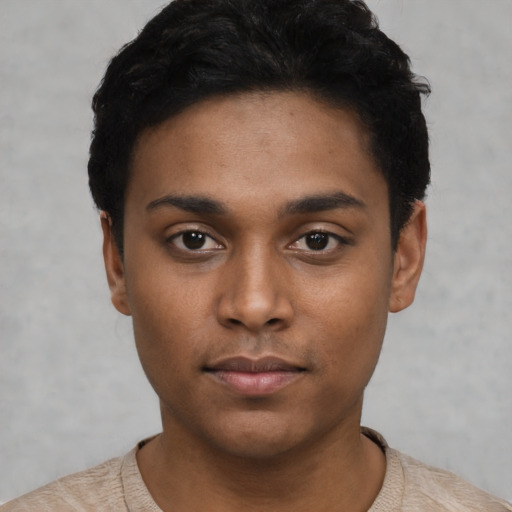 Neutral black young-adult male with short  black hair and brown eyes