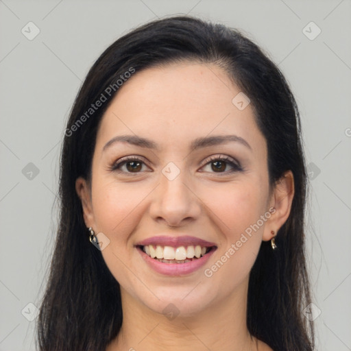 Joyful latino young-adult female with long  brown hair and brown eyes