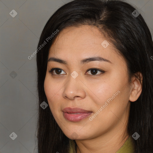 Joyful latino young-adult female with long  brown hair and brown eyes