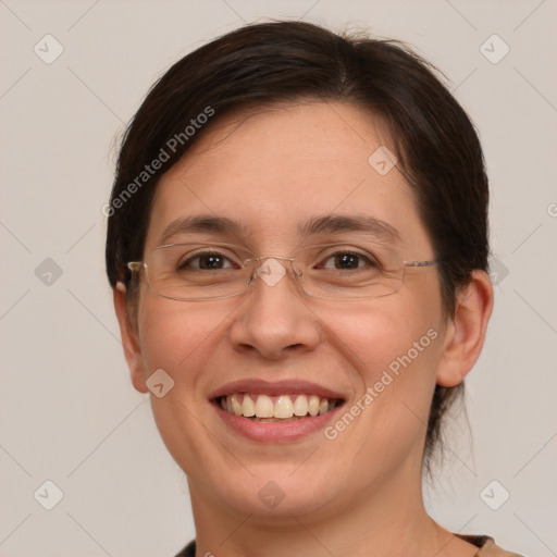 Joyful white adult female with medium  brown hair and brown eyes