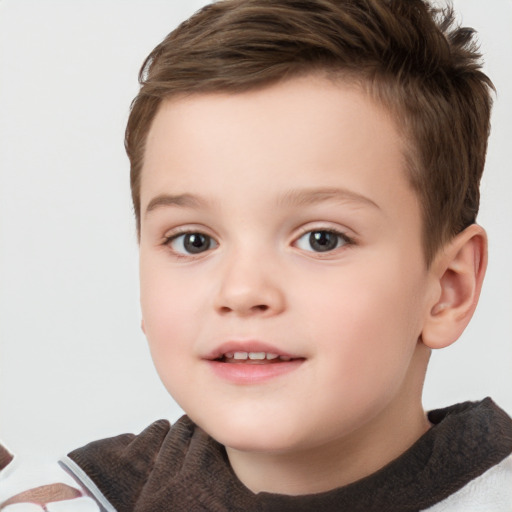 Joyful white child female with short  brown hair and brown eyes