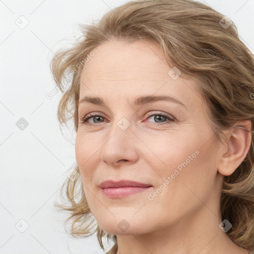 Joyful white young-adult female with medium  brown hair and blue eyes