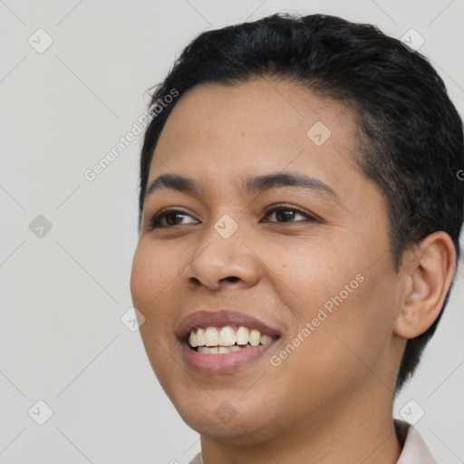 Joyful latino young-adult female with short  black hair and brown eyes