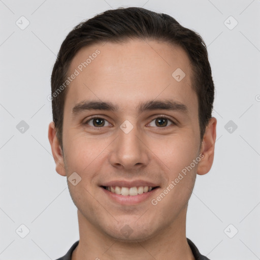 Joyful white young-adult male with short  brown hair and brown eyes