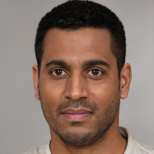 Neutral black young-adult male with short  black hair and brown eyes