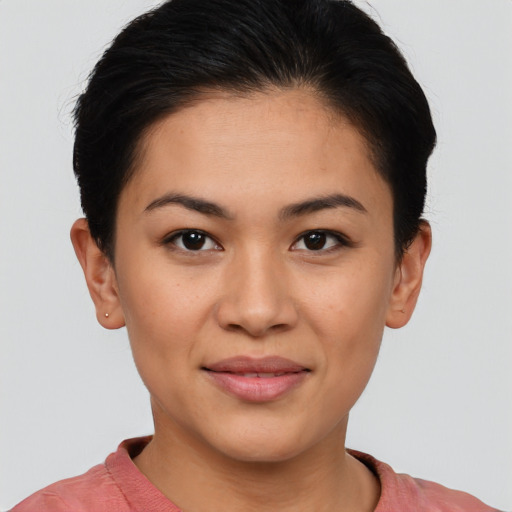 Joyful asian young-adult female with short  black hair and brown eyes