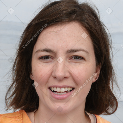 Joyful white adult female with medium  brown hair and grey eyes