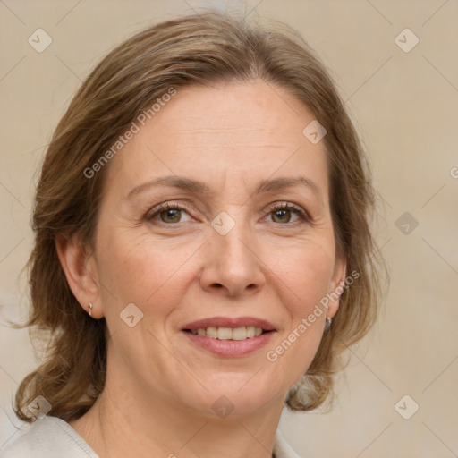 Joyful white adult female with medium  brown hair and grey eyes