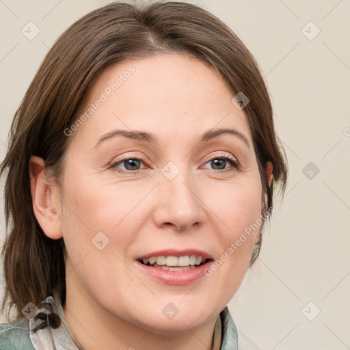 Joyful white adult female with medium  brown hair and blue eyes