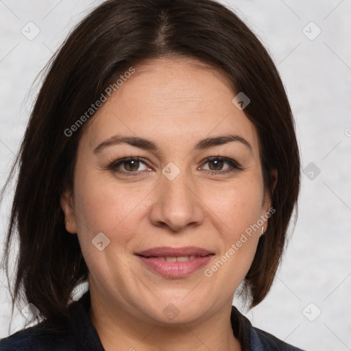 Joyful white adult female with medium  brown hair and brown eyes