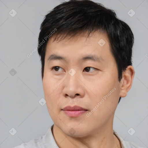 Neutral asian young-adult male with short  black hair and brown eyes