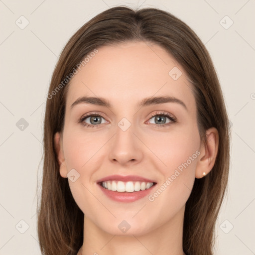 Joyful white young-adult female with long  brown hair and green eyes