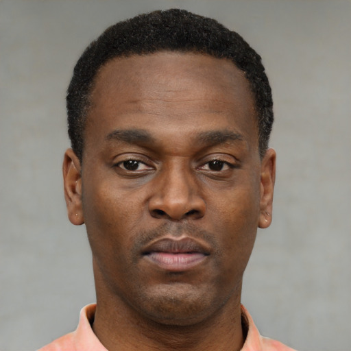 Neutral black young-adult male with short  black hair and brown eyes