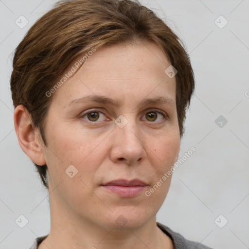 Joyful white adult female with medium  brown hair and grey eyes