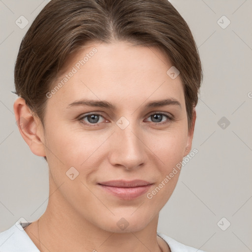 Joyful white young-adult female with short  brown hair and grey eyes