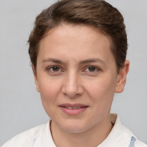 Joyful white young-adult female with short  brown hair and brown eyes