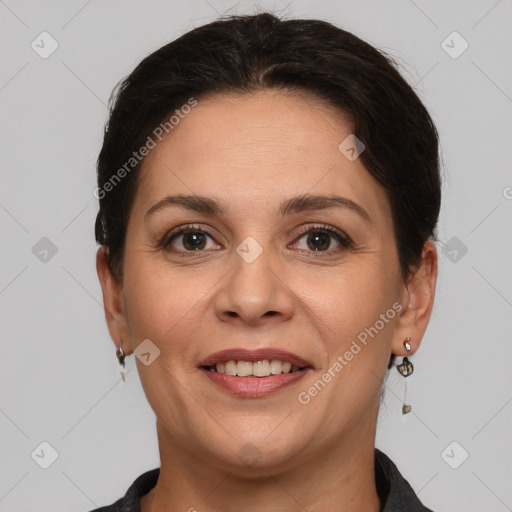 Joyful white adult female with short  brown hair and brown eyes