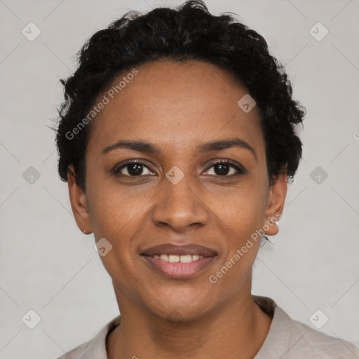 Joyful black young-adult female with short  black hair and brown eyes