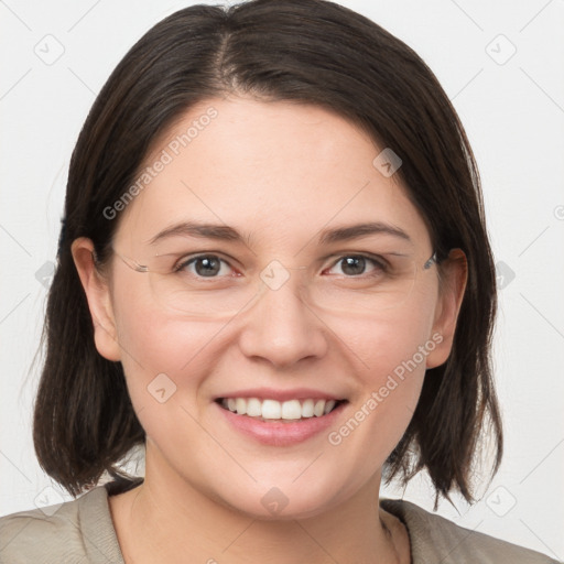 Joyful white young-adult female with medium  brown hair and grey eyes