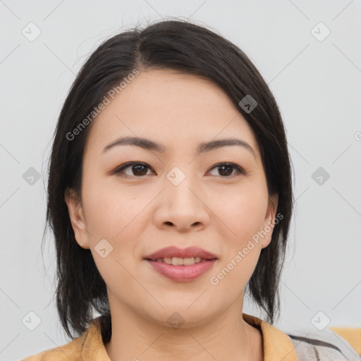 Joyful asian young-adult female with medium  black hair and brown eyes