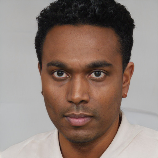 Neutral black young-adult male with short  black hair and brown eyes