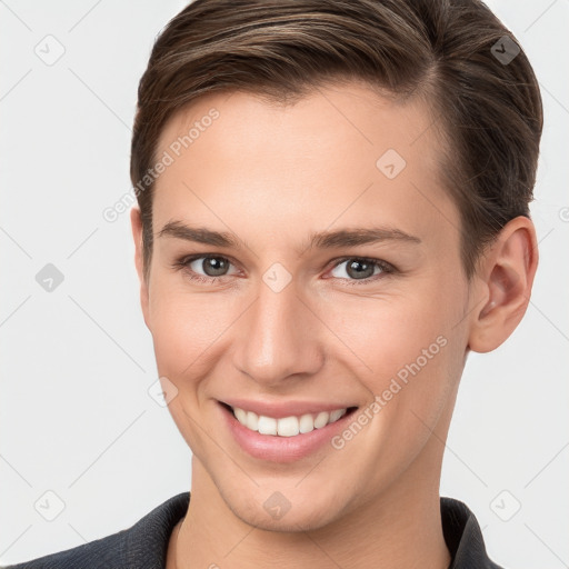 Joyful white young-adult female with short  brown hair and grey eyes