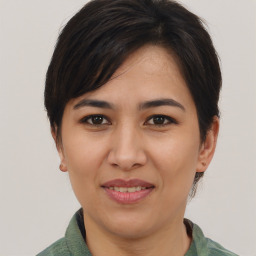 Joyful white young-adult female with medium  brown hair and brown eyes