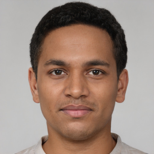 Neutral latino young-adult male with short  black hair and brown eyes