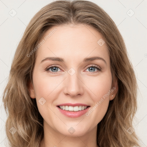 Joyful white young-adult female with long  brown hair and green eyes