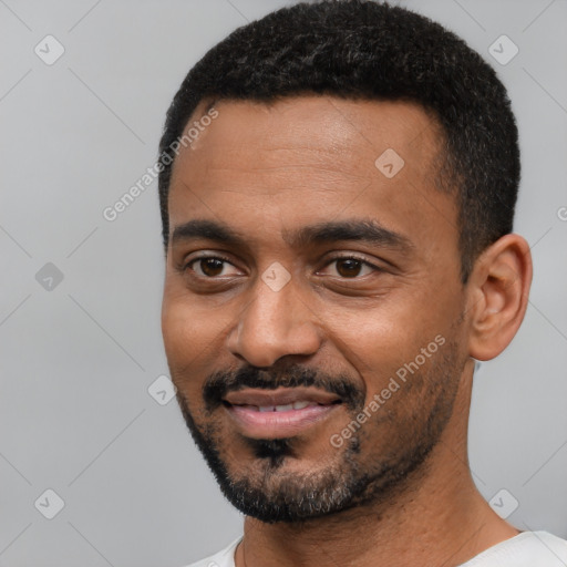 Joyful black young-adult male with short  black hair and brown eyes