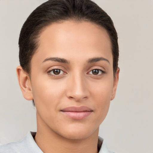 Joyful white young-adult female with short  brown hair and brown eyes