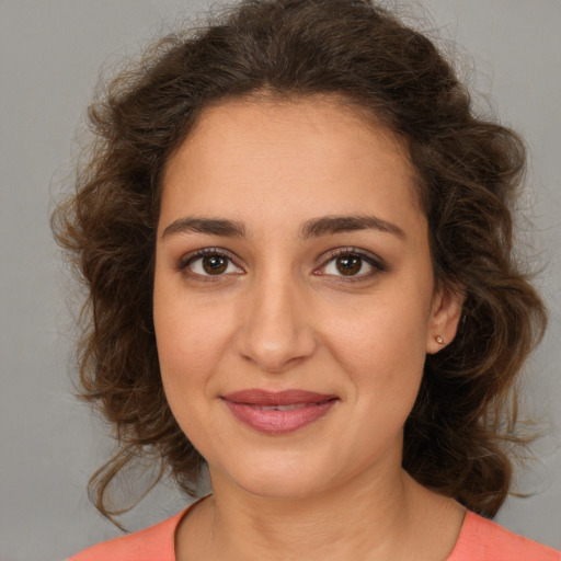 Joyful white young-adult female with medium  brown hair and brown eyes