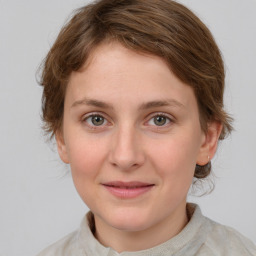 Joyful white young-adult female with medium  brown hair and blue eyes