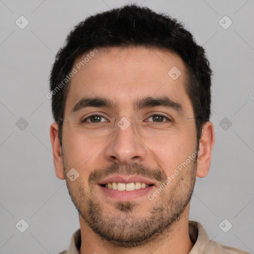 Joyful white young-adult male with short  black hair and brown eyes