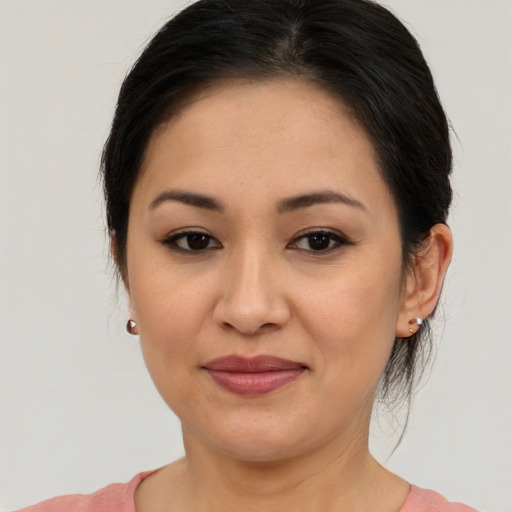 Joyful asian young-adult female with medium  brown hair and brown eyes