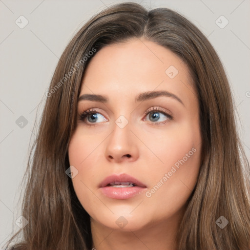 Neutral white young-adult female with long  brown hair and brown eyes