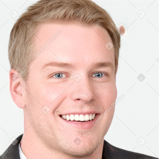 Joyful white young-adult male with short  brown hair and blue eyes