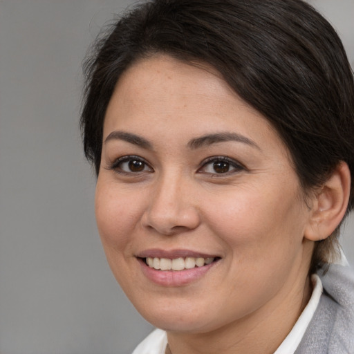Joyful white young-adult female with medium  brown hair and brown eyes